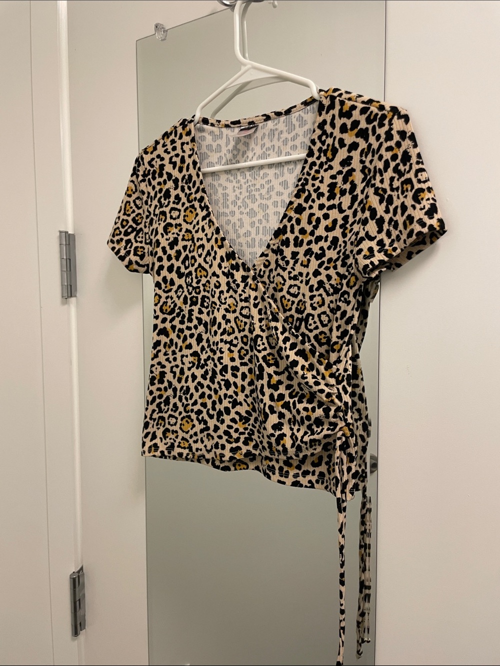No Boundaries Leopard Print Wrap Top in Beige, Black, and Tan